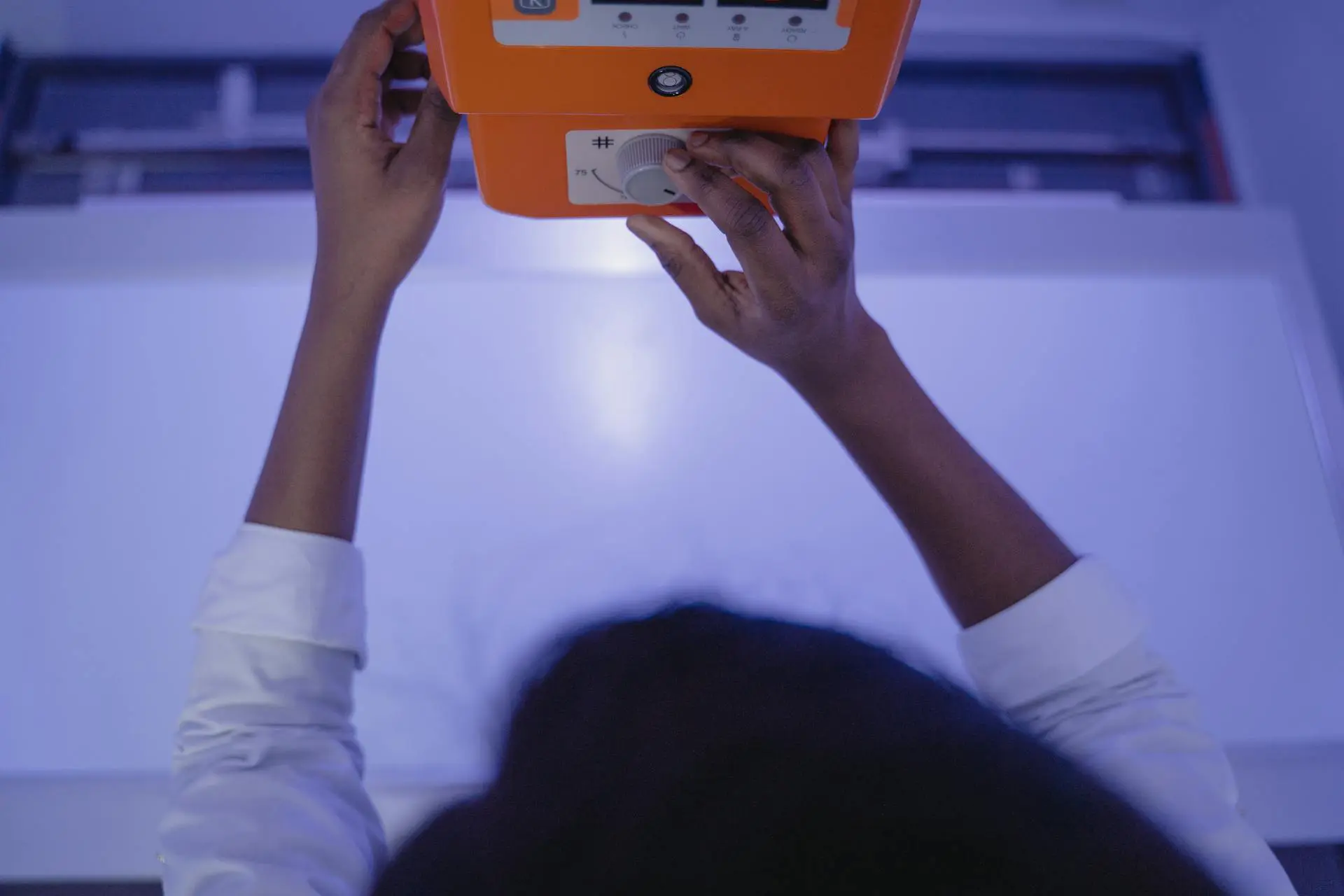 A vet is adjusting the x-ray machine.